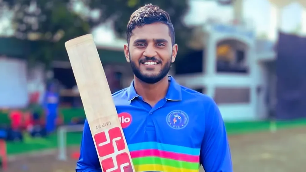 IPL 2025: Urvil Patel’s Exciting CSK Debut for Chennai Super Kings Urvil Patel holding a cricket bat in CSK jersey during IPL 2025 debut.