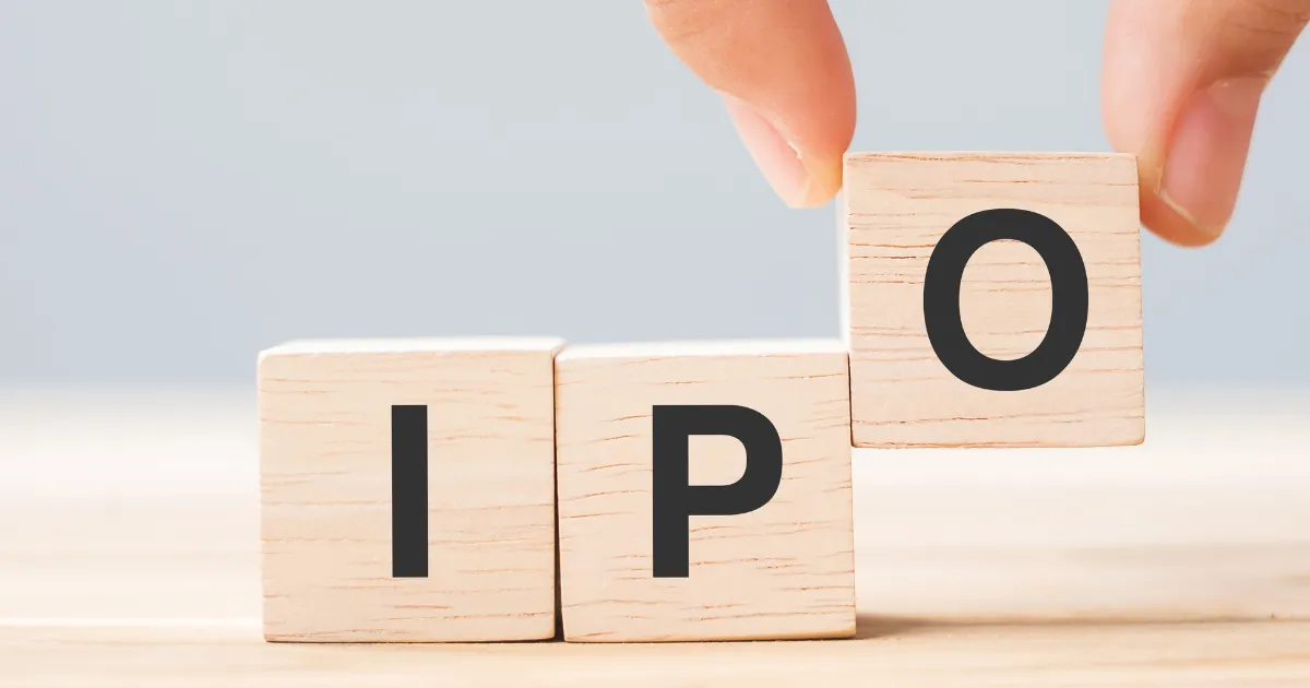 Close-up view of wooden blocks spelling IPO, symbolizing GNG Electronics IPO allotment status and the announcement of epic gains in 2025.