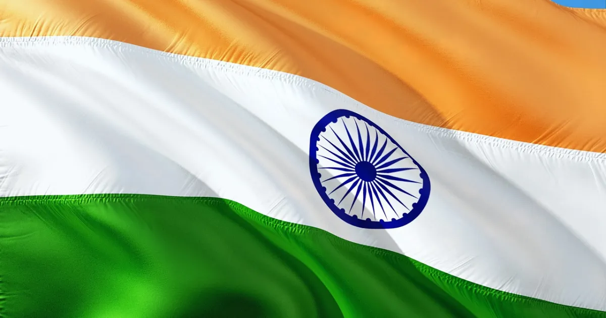 India global power ranking in 2025 - The Indian national flag, also known as the Tiranga, waving dynamically with its saffron, white, and green horizontal bands and the blue Ashoka Chakra visible in the center.