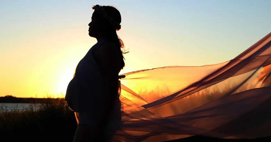 Is There a Solar Eclipse on August 2? Pregnancy & Solar Eclipse Myths, Facts, and Safety Silhouette of a pregnant woman at sunset, symbolizing common concerns about solar eclipses and pregnancy safety, with educational focus on scientific facts and avoidance of unproven risks.