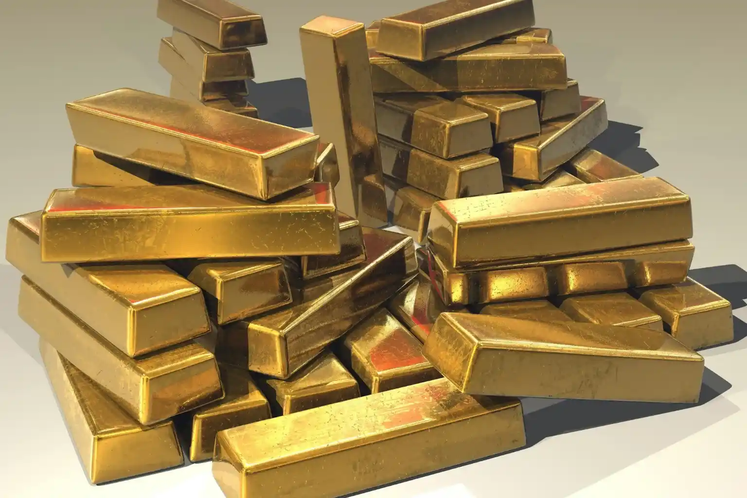 nh punjab Breaking News 39 Stacked gold bars illustrating the impact of rising gold prices relevant to Punjab’s economy and government relief measures.